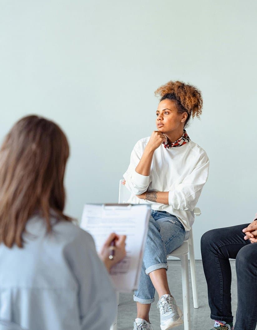 A healthcare professional listening during a consultation.
