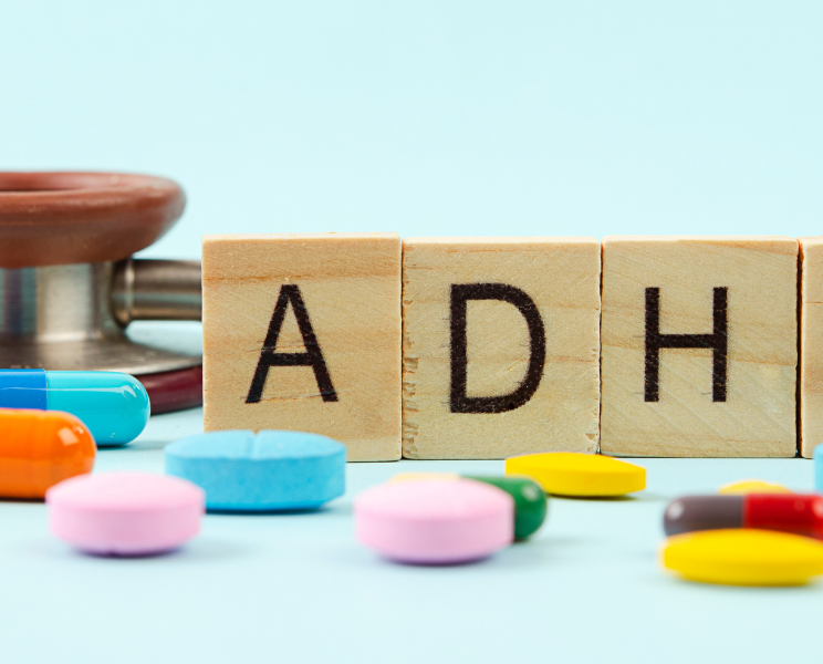 A child and adult showing early signs of ADHD such as difficulty focusing and restlessness