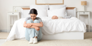 Causes of postpartum depression in new mothers including emotional stress and exhaustion after childbirth