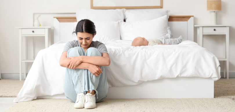 Causes of postpartum depression in new mothers including emotional stress and exhaustion after childbirth