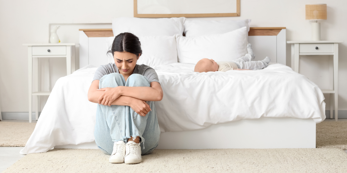 Causes of postpartum depression in new mothers including emotional stress and exhaustion after childbirth